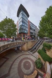 Pedestrian zone, modern architecture, concrete staircase, escalator, pedestrians as accessories,