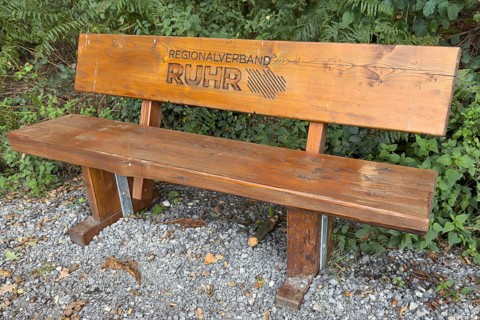 Wooden bench RVR bench with burnt-in lettering Regionalverband Ruhr in landscape conservation area