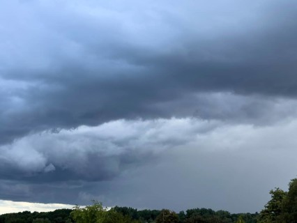 Gathering low pressure area with rain front dark stratus clouds Nimbostratus clouds over forest