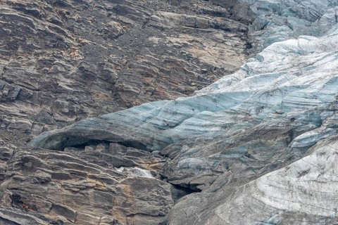 Majestic ice formations dominate the rocky terrain and show the beauty of a glacier in a secluded