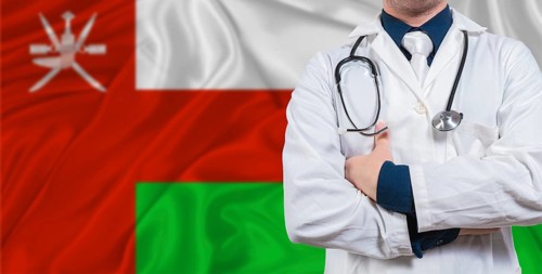Male doctor with stethoscope on Maldivian flag. Doctor holding stethoscope on Maldives flag