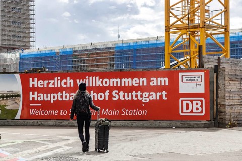 Welcome to Stuttgart Central Station. Banner at the entrance to the platforms. Rail travellers have