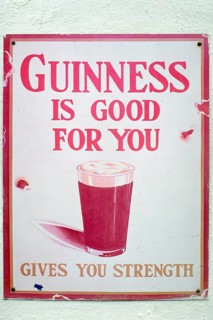 Old metal sign for Guinness beer, London, England, Great Britain