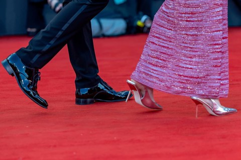 Venice, Italy - 2 September 2025: Tuxedo trousers, dinner jacket shoes and high heels during the