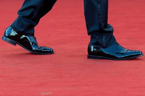 Venice, Italy - 2 September 2025: Tuxedo trousers and dinner jacket shoes during the red carpet of