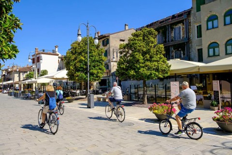 Cyclist, old town centre, Grado, Julian Friuli, Adriatic Sea, Italy