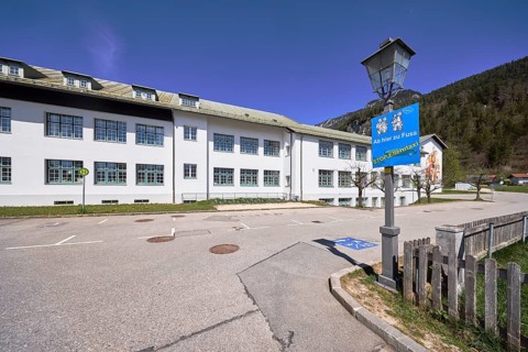 Primary and secondary school Bischofswiesen, sign Stop parent taxi, building, lantern, bus stop,