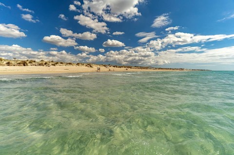 Crystal-clear turquoise water on the beach at Torre San Giovanni, Marina di Ugento, Apulia, Italy