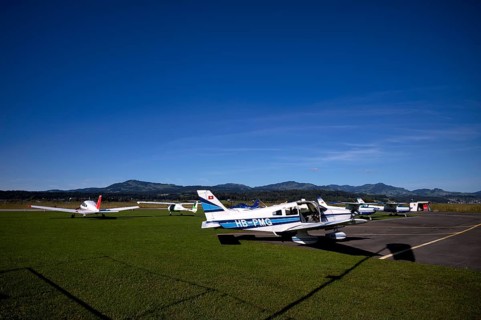 Pipistrel Velis Club on the right with aircraft registration HB-NPP stands next to Piper Archer II