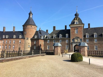 View of entrance portal and towers of moated castle moated castle Schloss Anholt, Isselburg, North
