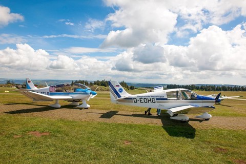 View of two single-engine cantilever low-wing propeller aircraft Light aircraft left type Robin DR