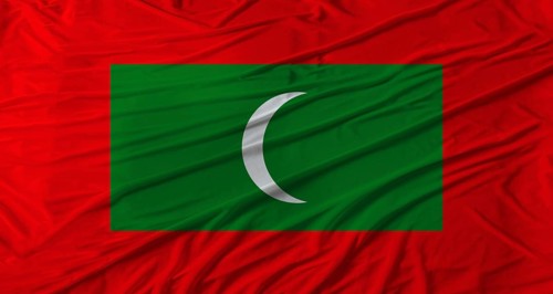 Close up of Maldives flag waving. Flag of Maldives with cloth texture