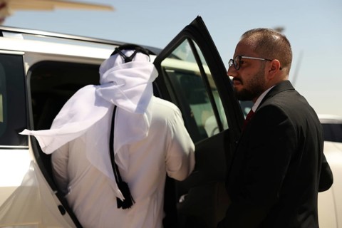 Officials from the Qatari and Syrian Red Crescents receive a Qatari airlift of aid to help the