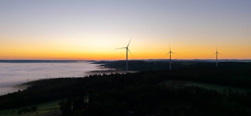 Several wind turbines above a foggy landscape at sunrise, near Schorndorf, Rems-Murr district,