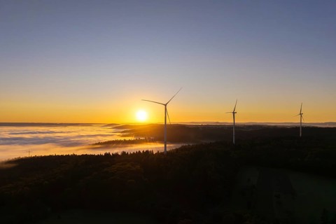 Three wind turbines towering in the morning landscape with fog, near Schorndorf, Rems-Murr-Kreis,