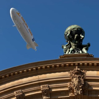Main front of the main railway station with Atlas carrying the globe on his shoulders and a