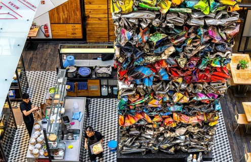 Interior design, artwork made from compressed scrap cars, partially vacant Shopping Quartier 205 in