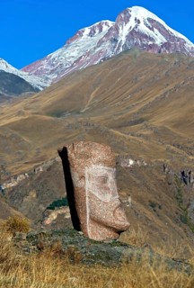 Stone sculpture of a male head, open-air exhibition Stone Heads of Sno by sculptor Merab
