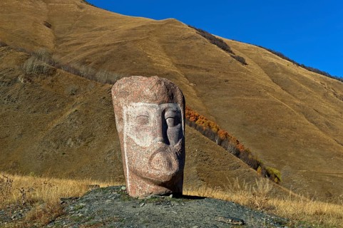 Stone sculpture of a male head, open-air exhibition Stone Heads of Sno by sculptor Merab