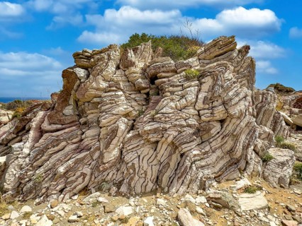 Tourist attraction destination Agios Pavlos Rock with striking folded rock, Agios Pavlos, Crete,