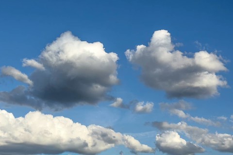 Photo from above two altocumulus clouds cluster clouds below in the background white stratocumulus