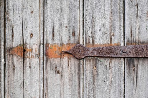 Detail of an old wooden door with rusty metal fittings, texture, background, Münsterland, North