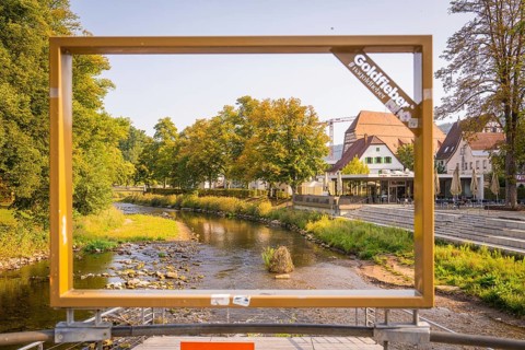 A river, framed by a large frame, in an urban landscape, small town pearl Nagold, Black Forest,
