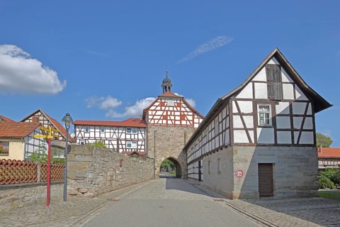 Historic Lower Tor with spire and clock and half-timbered houses, Tor tor, town gate, town wall,