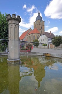 Market fountain and town church of Our Lady built 16th century, water basin, reflection, market,