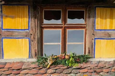 Window in a half-timbered house with Christmas decorations, Alsace, France
