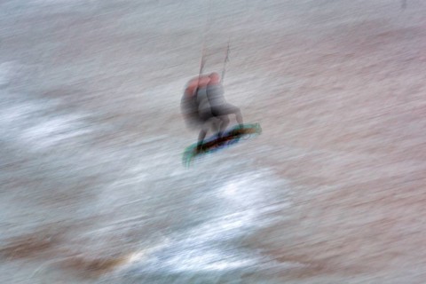 Kitesurfer jumping in the surf, wiping effect, long exposure, Sankt Peter-Ording, Eiderstedt