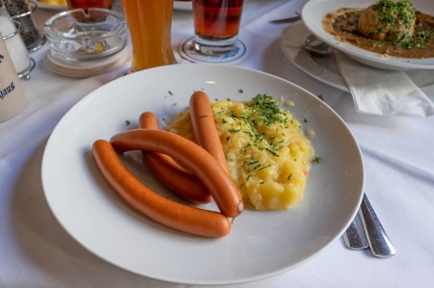 Viennese sausages with potato salad served in a beer garden, Bavaria, Germany