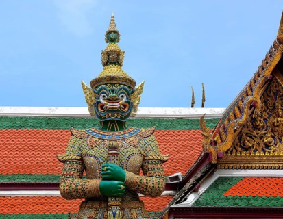 Colorful giant yaksha statue guarding the entrance of wat phra kaew, temple of the emerald buddha,