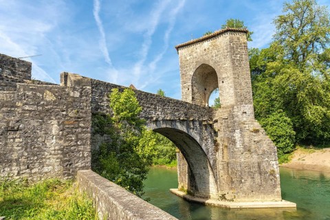 The historic stone bridge in sauveterre de bearn, france, stands majestically over the gave