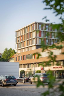 Office building on a street with cars and modern architecture, Nagold, district of Calw, Black