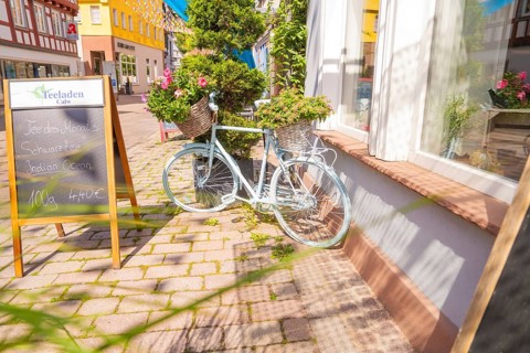 Scenes of a charming street with a pale bicycle and flowers, small town of Perle Calw, district of