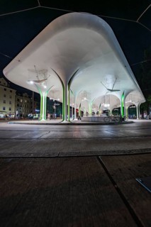 Stylish bus stop at night with illuminated architectural designs, Munich, Germany