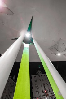 Modern architecture at night with illuminated abstract shapes and acute angles, Munich, Germany