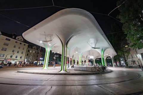 Modern bus stop with striking lighting and structural design elements, Munich, Germany