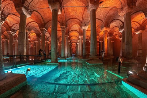 Tourists walking on a walkway in the basilica cistern, a historical landmark in istanbul, turkey,