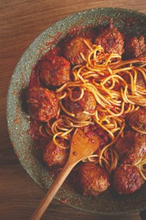 Spaghetti with meatballs, in tomato sauce, cooking in a frying pan, no people, homemade