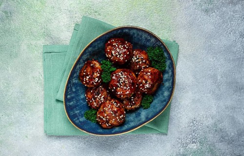 Tsukune, Japanese meatballs, minced chicken, fried on a skewer, with yakitori sauce, homemade, no