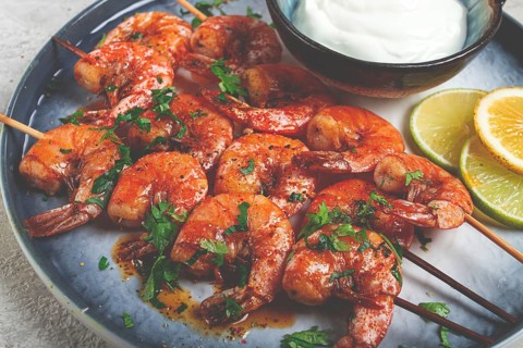 Fried shrimp, without a head, on skewers, shrimp kebabs, with spices, grilled, homemade, without