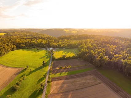 Wide landscape with shadow play over fields and forests at sunset, VFL Stammheim, Calw, Black