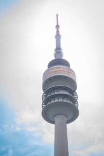 Architecturally striking television tower with spiral structure in front of a cloudy sky, Olympic