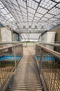 Metal grid access to part of the stadium under a large roof, Olympiapark, Munich, Germany