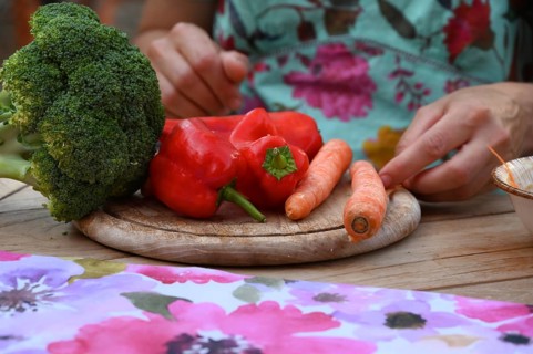 Fresh vegetables on a wooden board, broccoli, carrots and peppers, Bavaria, Germany