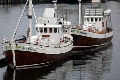 Two small ships in the harbour, Husavik, Iceland