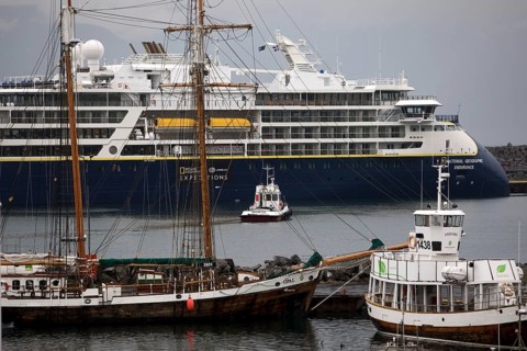 A cruise ship, a sailing ship and other ships and boats in the harbour, Husavik, Iceland