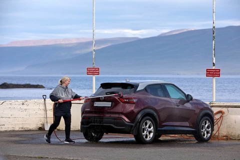 Washing the car with the free water brush at the petrol station by the Vopnafjördur fjord, East